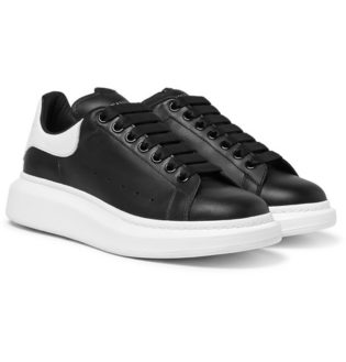 black tennis shoes with black soles