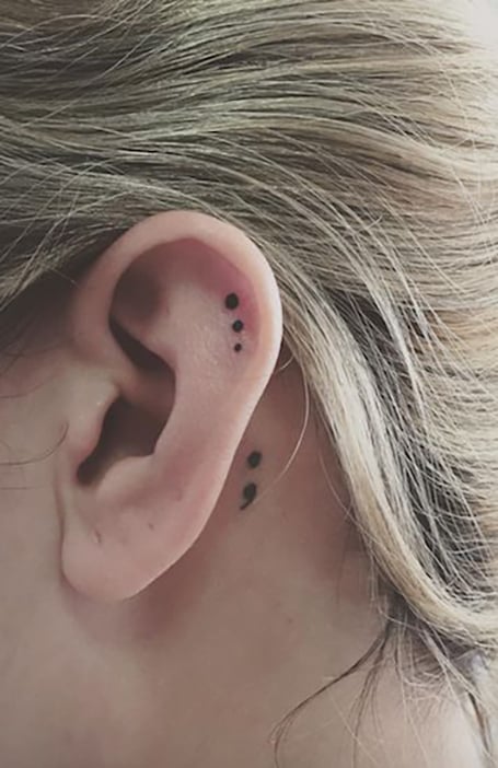 what does a semicolon tattoo mean behind the ear