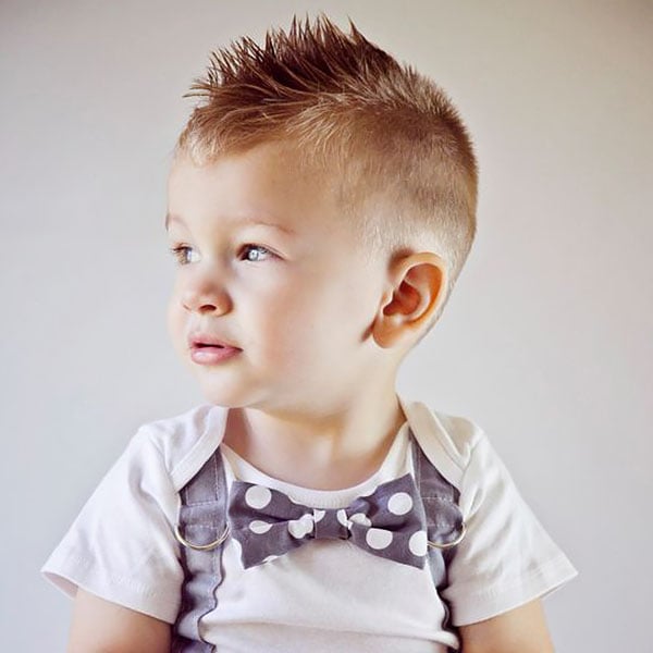 Cute Blond Baby Boy in a Barber Shop Having Haircut by Hairdresser. Hands  of Stylist with Hairbrush. Children Fashion Stock Image - Image of  barbershop, client: 145291183