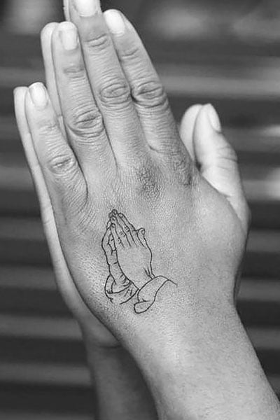 Womens open hand with fingers outstretched and love tattoo on wrist Stock  Photo  Adobe Stock