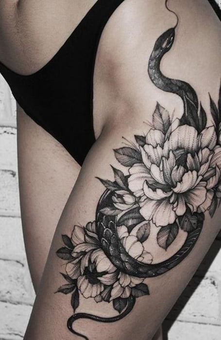 Tattoo uploaded by Yink Tattoos  Large snake floral piece placed on the  thigh  Tattoodo