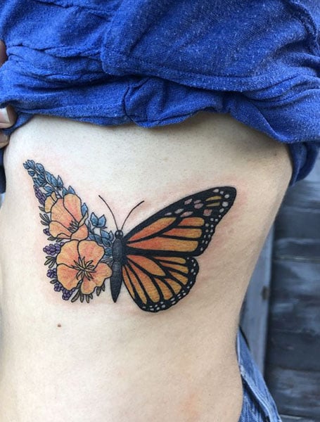 A monarch butterfly tattoo in memory of her dad