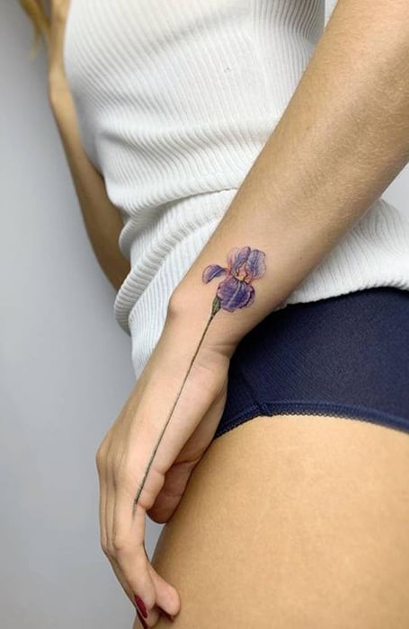 Beautiful flower tattoos on the left hand and wrist  Tattoogridnet
