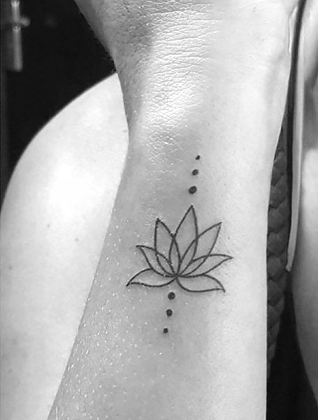 Fine line lotus flower tattooed on the ankle | Small lotus tattoo, Lotus  flower tattoo, Pink lotus tattoo