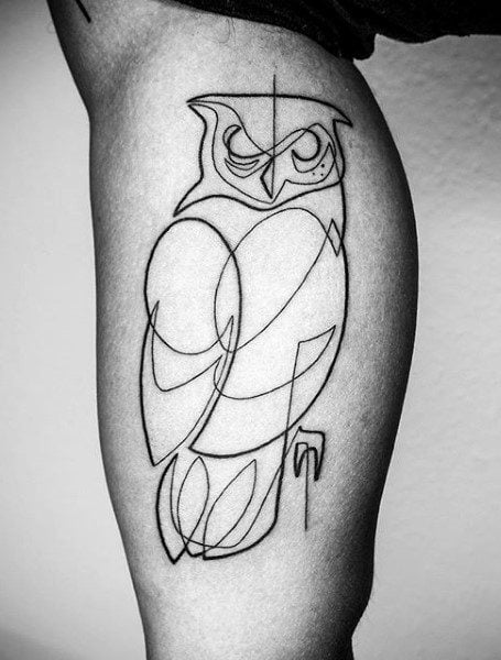 Minimalistic owl tattooed on the finger