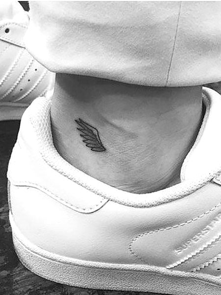 Angel wings halo and initials tattoo  Tiny wrist tattoos Small hand  tattoos Remembrance tattoos