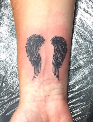 20 Cool Angel Wing Tattoos for Men in 2024 - The Trend Spotter