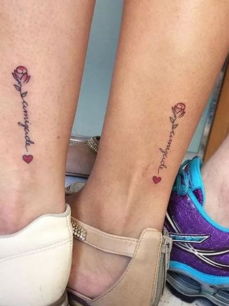 Small flower tattoo on the left ankle.