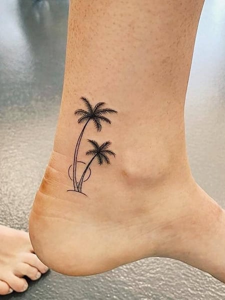 Flower wreath tattoo on the ankle bone