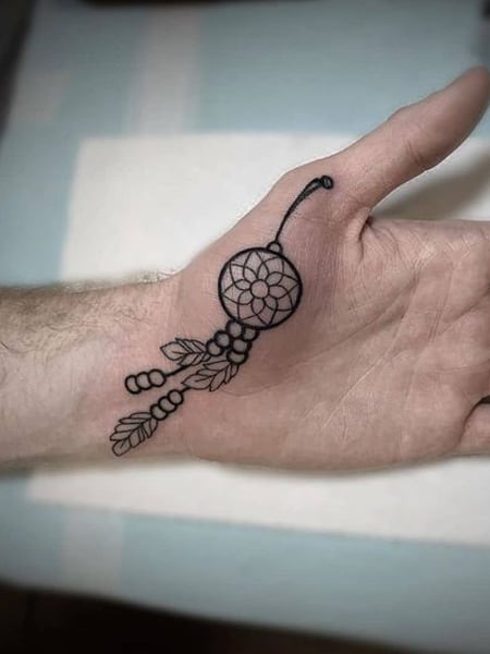 dreamcatcher tattoo on inner arm