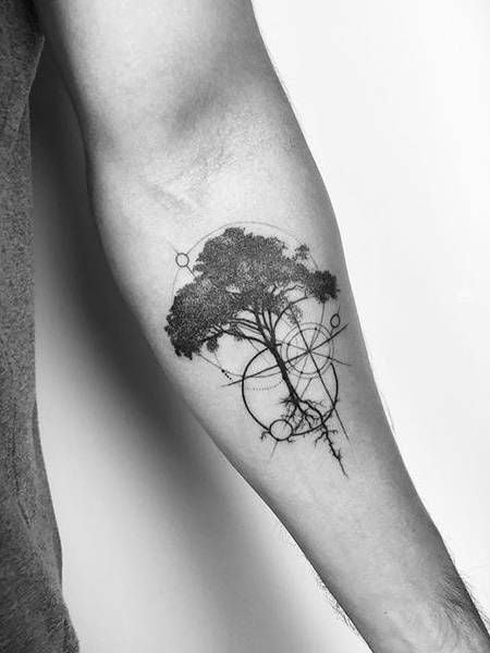 Watercolor tree tattoo on the left upper arm and