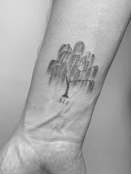 Fine line pine tree tattoo on the back