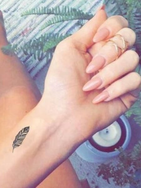 25 Feather Tattoos For Women In 22 The Trend Spotter