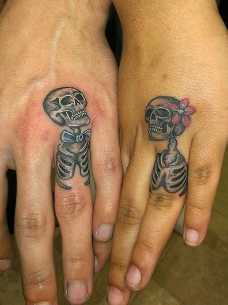 20 fascinating skeleton hand tattoo ideas to decorate your skin  YENCOMGH