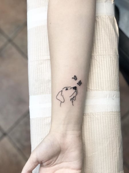 Cat and dog outline tattoo on the upper back