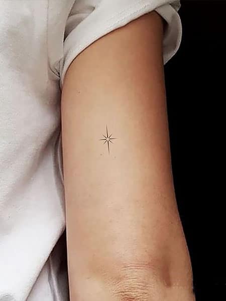 Minimalist north star tattoo on the wrist