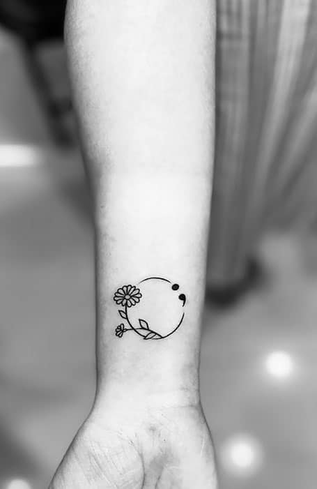 A floral tattoo with a semicolon by tattooartistrybyjenna  Empowering Semicolon  Tattoos To Carry On The Hope Of   Small tattoos Semicolon tattoo Cool  tattoos