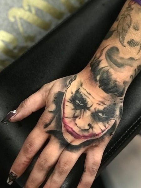 25 Best Joker smile hand tattoo ideas  joker smile hand tattoo hand  tattoos skull hand tattoo