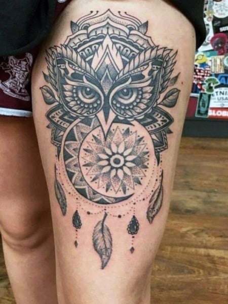 Traditional style owl tattoo on the thigh