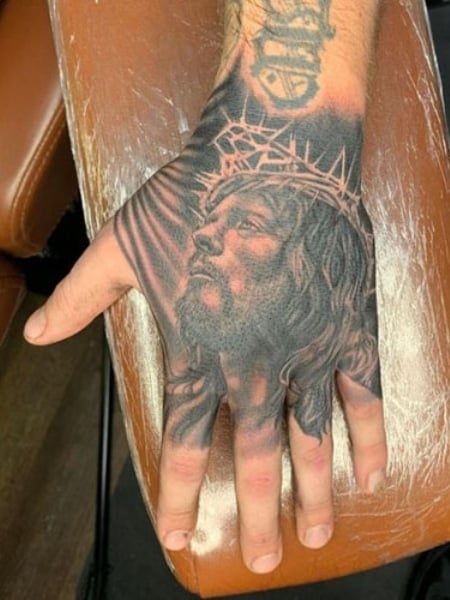 Side view of a Tattoo of Jesus Christ on a mans Right arm above the elbow  Stock Photo  Alamy