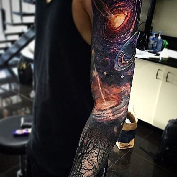 Minimalist galaxy tattoo on the inner forearm