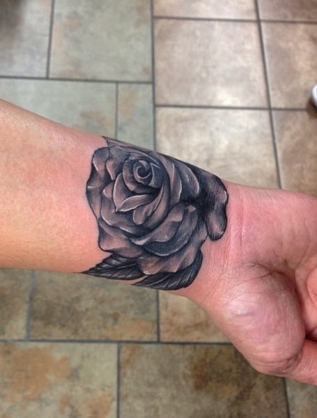 Flower bracelet that includes a red rose. | Tattoo bracelet, Bracelet  tattoos with names, Wrist tattoos for guys