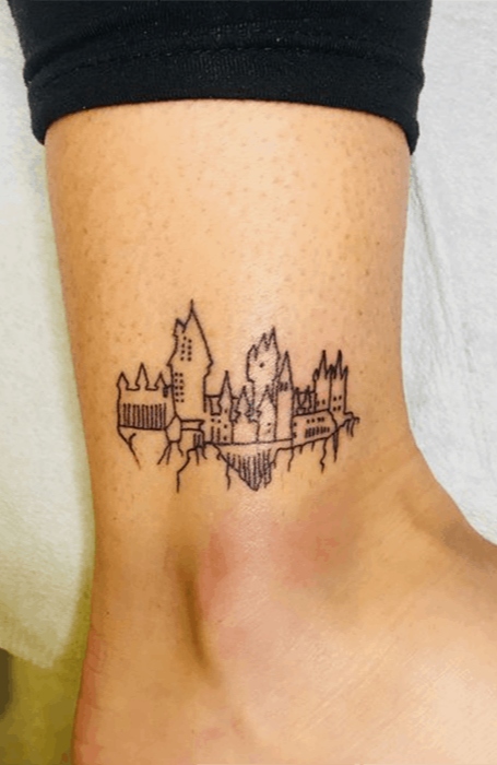 Tattoo uploaded by Xavier  Hogwarts skyline tattoo by Adam Fox hogwarts  harrypotter hp skyscraper landmark skyline silhouette minimalist  subtle simple outline microtattoo  Tattoodo